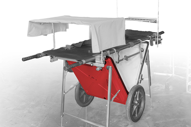 Auf dem Bild ist ein roter, tragbarer Wagen mit einem Überdach und mehreren Funktionen zu sehen.