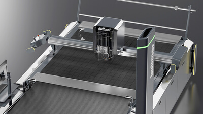 Auf dem Bild ist eine moderne Maschinenanlage zu sehen, vermutlich zum Schneiden oder Bearbeiten von Materialien.