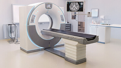 Auf dem Bild ist ein modernes CT-Gerät in einem medizinischen Raum zu sehen.