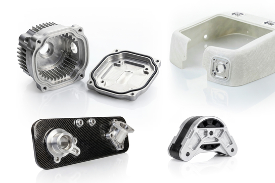 Das Bild zeigt verschiedene technische Bauteile, wahrscheinlich aus dem Maschinenbau oder der Automobiltechnik, aus unterschiedlichen Materialien wie Aluminium und Carbon.